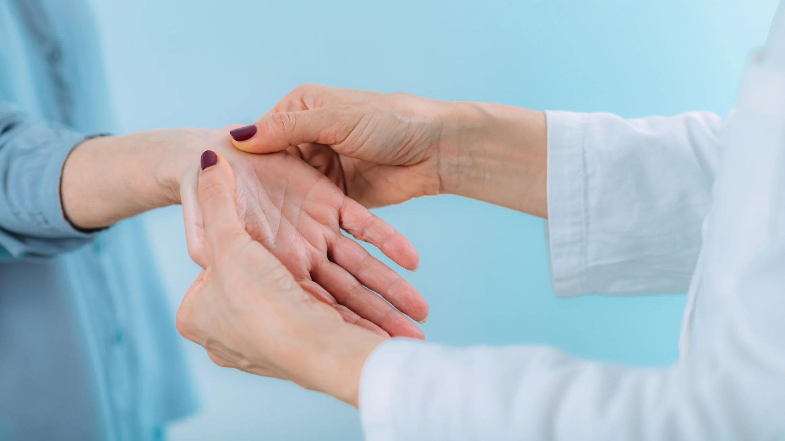 A doctor checking a patient for carpal tunnel.